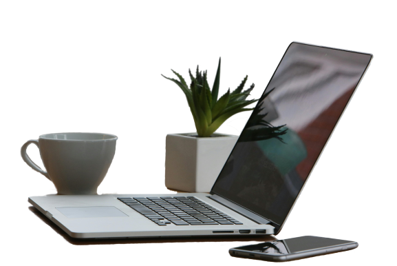 image of computer and phone with a cup and pot plant